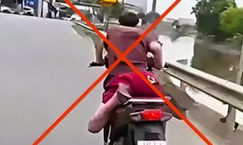 Xử phạt thanh niên nằm trên yên xe 'làm xiếc' trên đường